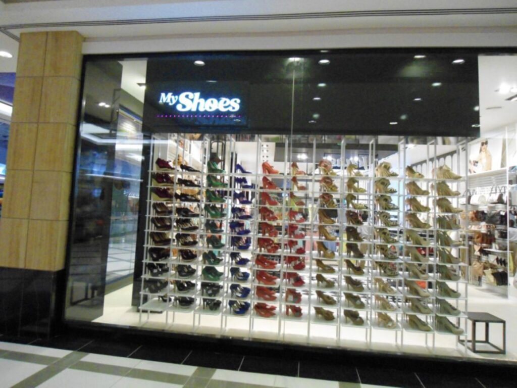 Modern acrylic LED sign board for MyShoes retail showroom by LED sign board manufacturers in Hyderabad, Jubilee Hills.