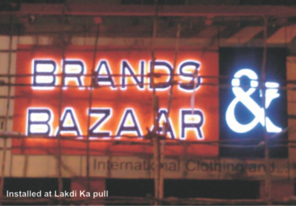 Backlit LED glow sign board with illuminated acrylic letters for Brands Bazaar showroom in Hyderabad, Lakdikapul.