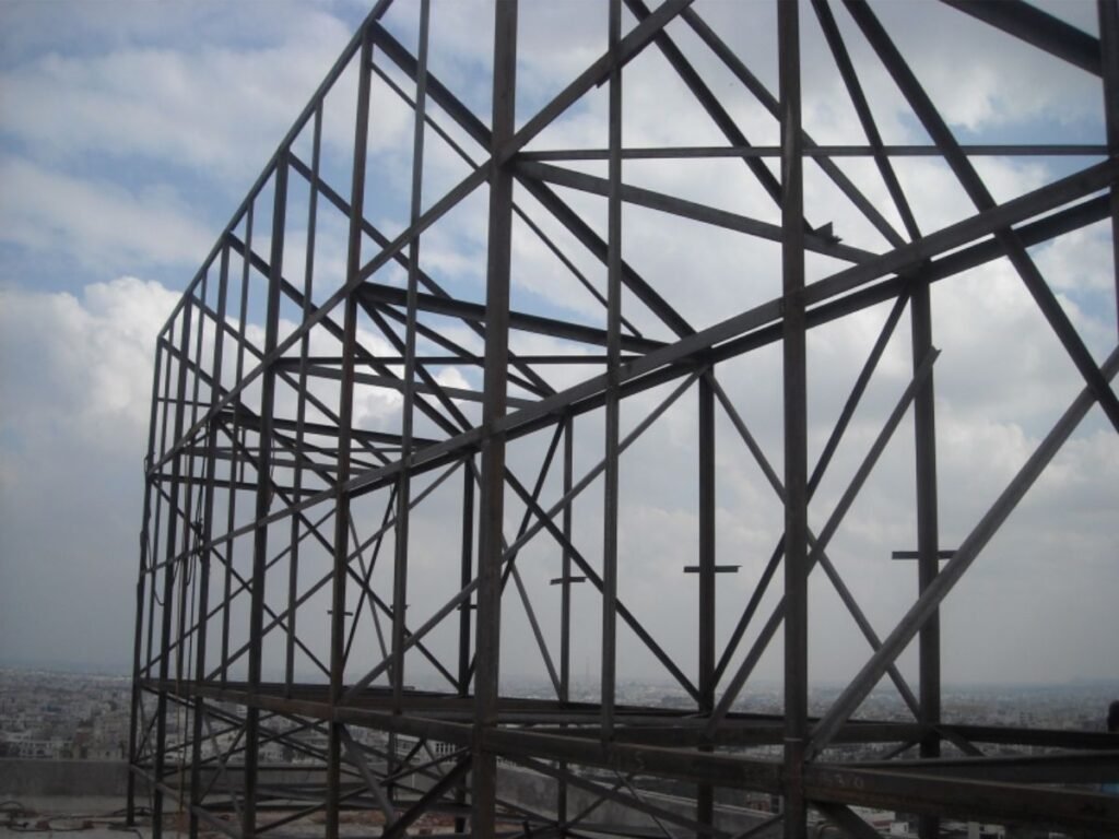 Heavy-duty rooftop steel structure fabricated for large outdoor LED sign board installation in Hyderabad, Gachibowli.