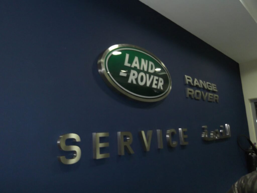 Interior stainless steel letters and corporate branding for Land Rover service center in Hyderabad, Madhapur.