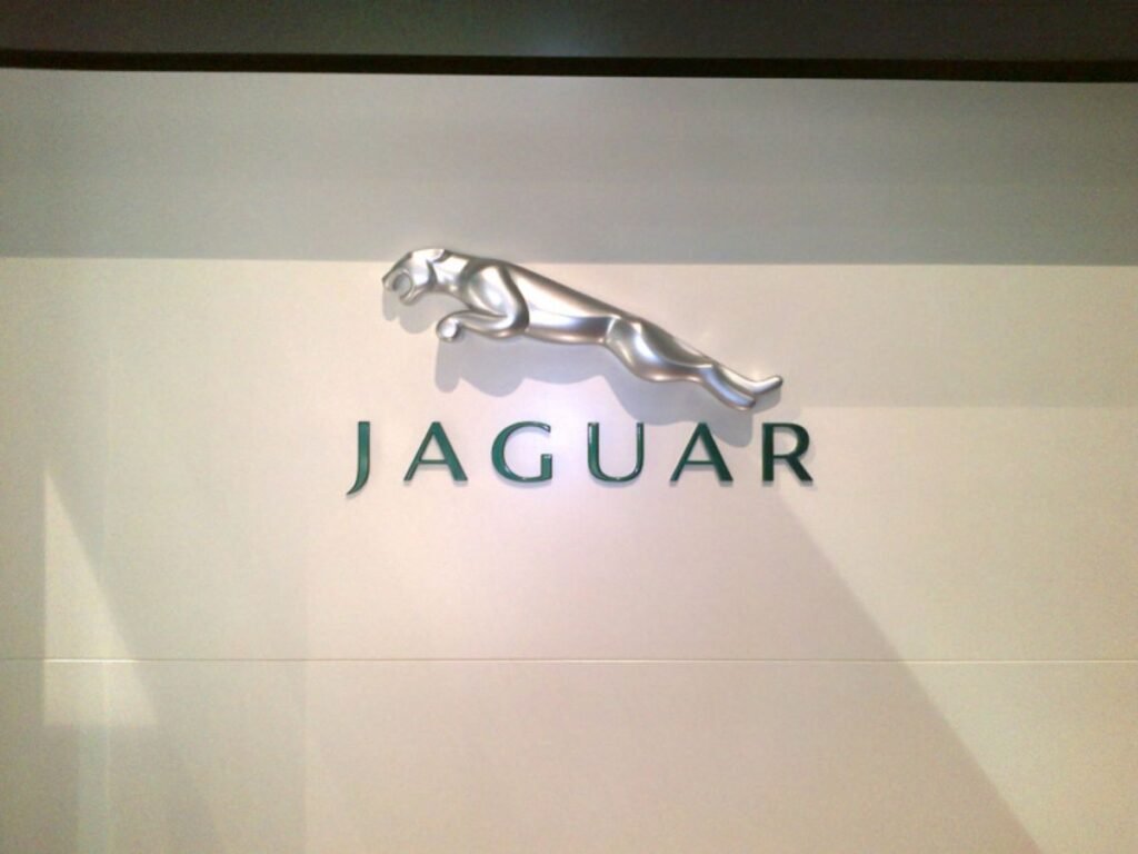 Luxury Jaguar showroom wall logo with premium acrylic letters and interior branding in Hyderabad, Banjara Hills.