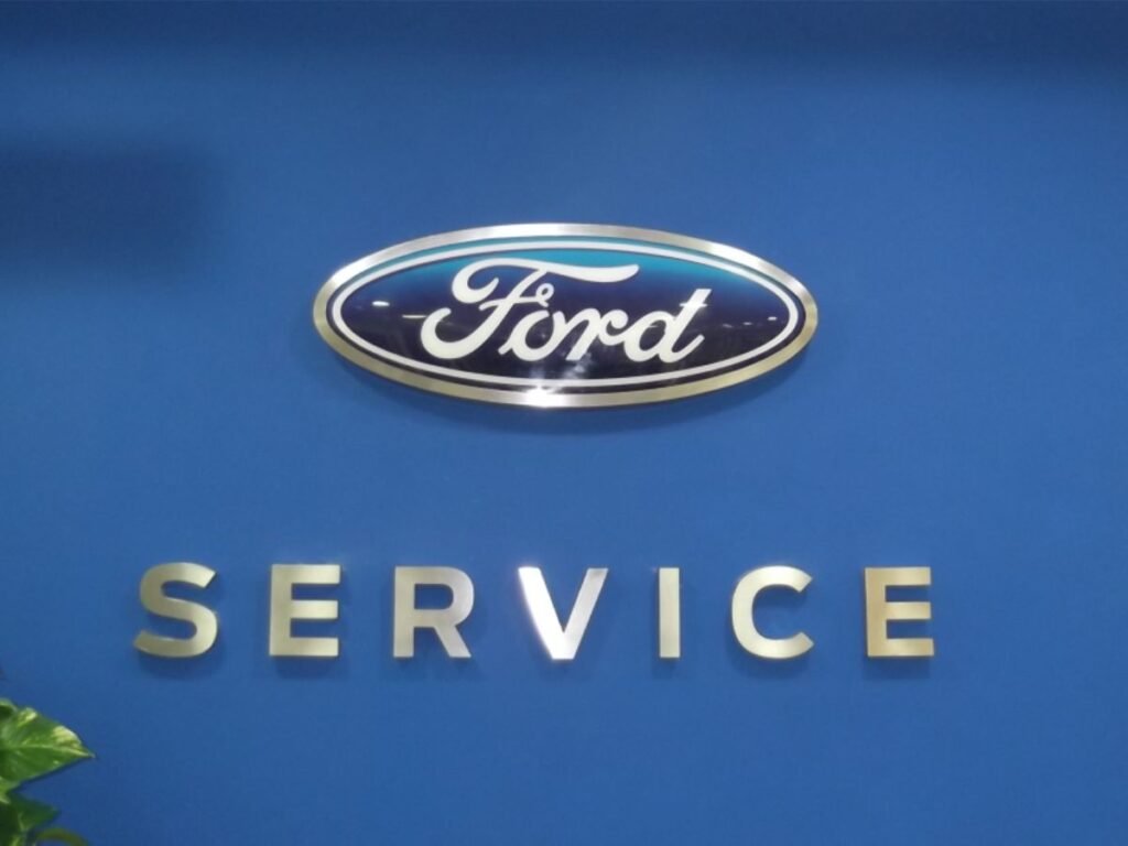 Ford service center interior signage with stainless steel letters and custom branding in Hyderabad, Kukatpally.