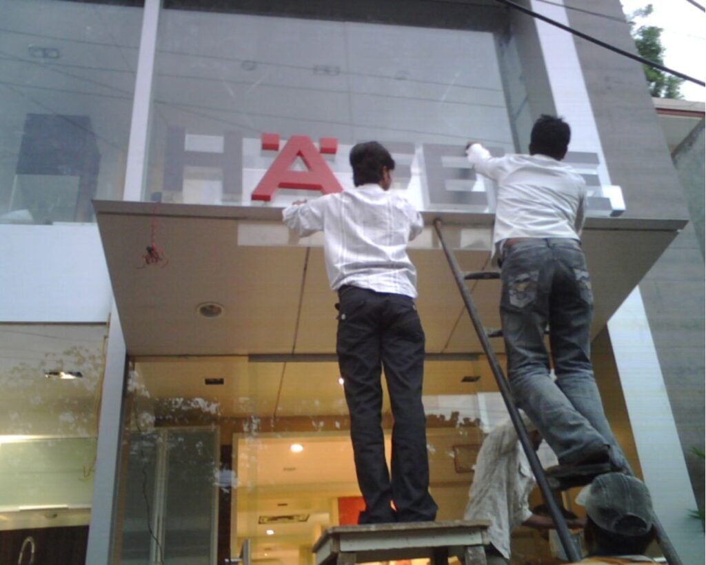 Professional installation of 3D acrylic channel letters for Hafele showroom signage in Hyderabad, Banjara Hills.
