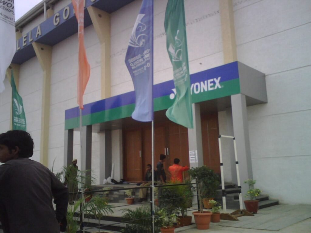 Custom exhibition branding and entrance signage by Sina Interior & Signage in Hyderabad featuring premium façade graphics, event branding, and promotional flags.