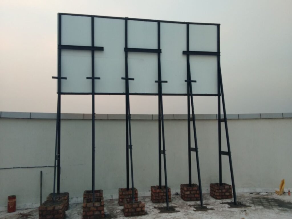 Heavy-duty billboard steel fabrication and outdoor signage structure installation by Sina Interior & Signage in Hyderabad.
