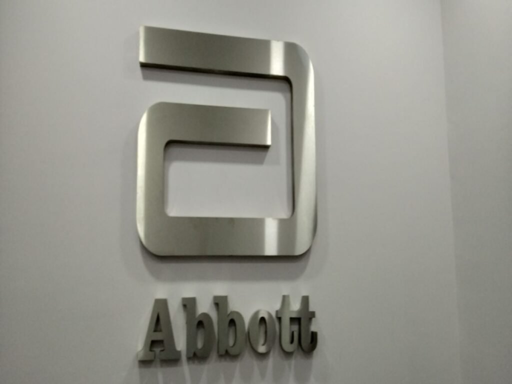 Premium stainless steel logo signage and corporate office branding by Sina Interior & Signage in Hyderabad for reception and office interiors.