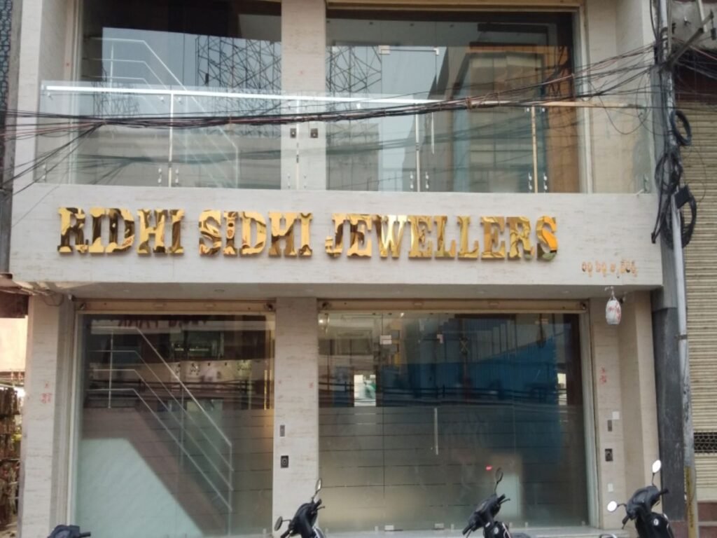 Premium gold stainless steel letter signage for Ridhi Sidhi Jewellers designed and installed by Sina Interior & Signage in Hyderabad for luxury retail branding.