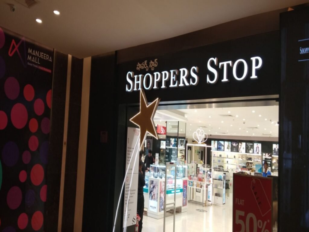 Illuminated storefront signage for Shoppers Stop at Manjeera Mall installed by Sina Interior & Signage in Hyderabad featuring premium LED channel letters.