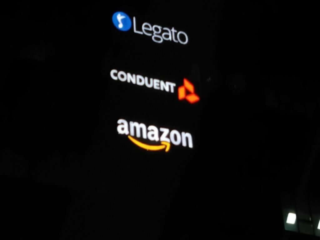Night view of illuminated corporate building signage for Legato, Conduent, and Amazon installed by Sina Interior & Signage in Hyderabad.