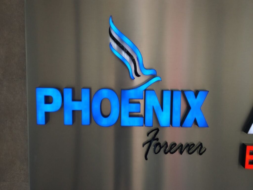 Backlit acrylic logo signage for Phoenix Forever manufactured by Sina Interior & Signage in Hyderabad featuring premium LED illuminated branding.